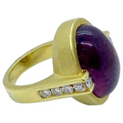 18 Karat Yellow Gold Ring with Oval Cabochon Rubellite and .65 Carat Diamonds