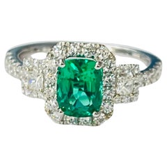 Emerald and Diamond Engagement Ring In 18K White Gold.