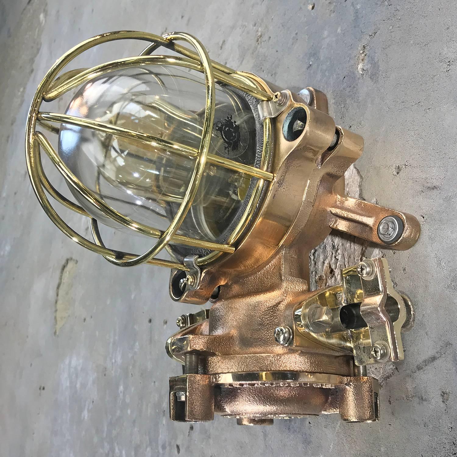 Kokosha flame proof cast bronze wall or ceiling light fitted with Edison squirrel cage filament bulb made in the 1990s by Kokosha - Osaka, Japan. 

These fixture also feature brass cable grips and brass wire cage.

Made in the 1990s by Kokosha -